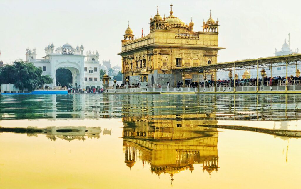 Golden Temple at sunrise with reflections in the Sarovar